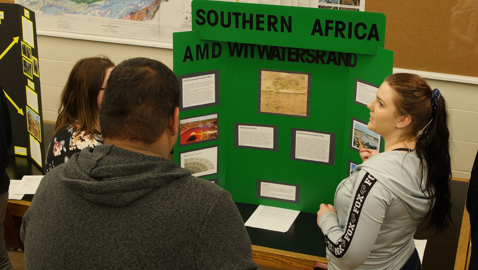 Photo of students at a booth during the tradeshow
